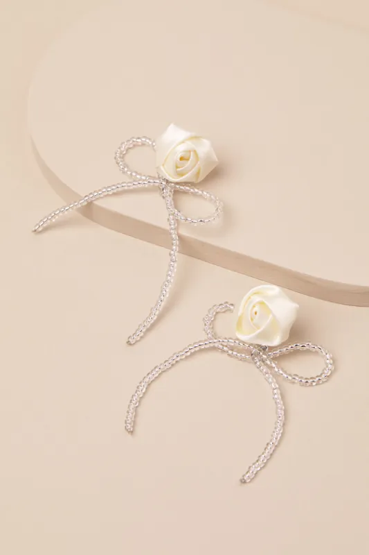 Lanney Ivory Rosette Beaded Bow Earrings sold by Lulus