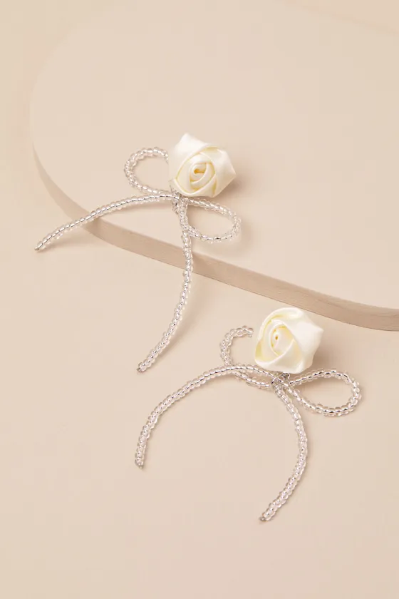 Lanney Ivory Rosette Beaded Bow Earrings sold by Lulus