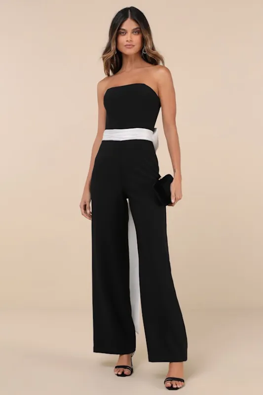 Sleek Perfection Black and White Strapless Bow Jumpsuit sold by Lulus