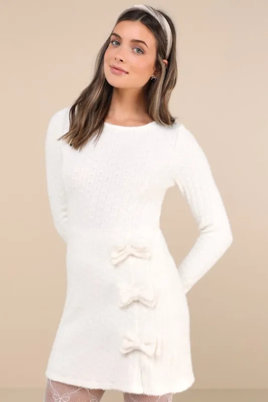 Darling Coziness Ivory Fuzzy Ribbed Knit Bow Sweater Mini Dress sold by Lulus