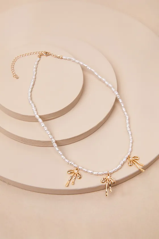 Desired Perfection Gold Pearl Rhinestone Bow Charm Necklace sold by Lulus product image thumbnail 3
