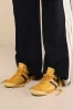 Race Sun and Black Leather Lace-Up Sneakers sold by Lulus
