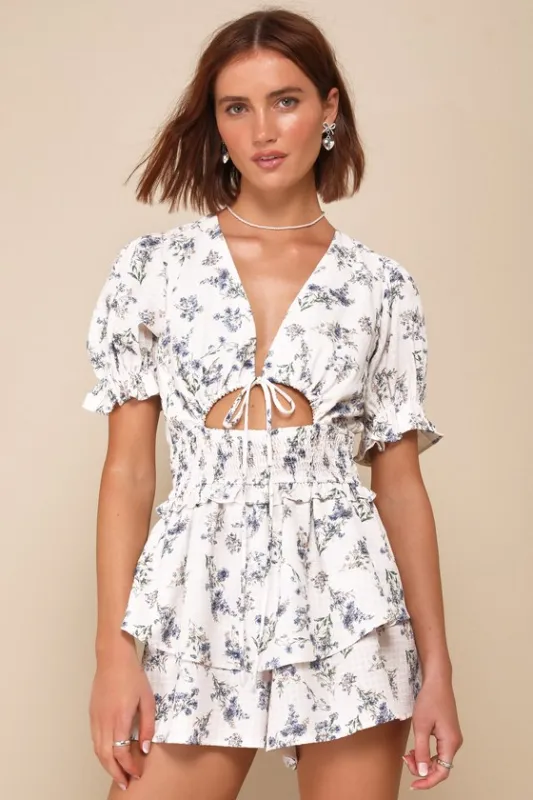 Complete Babe Ivory Floral Textured Tiered Smocked Cutout Romper sold by Lulus