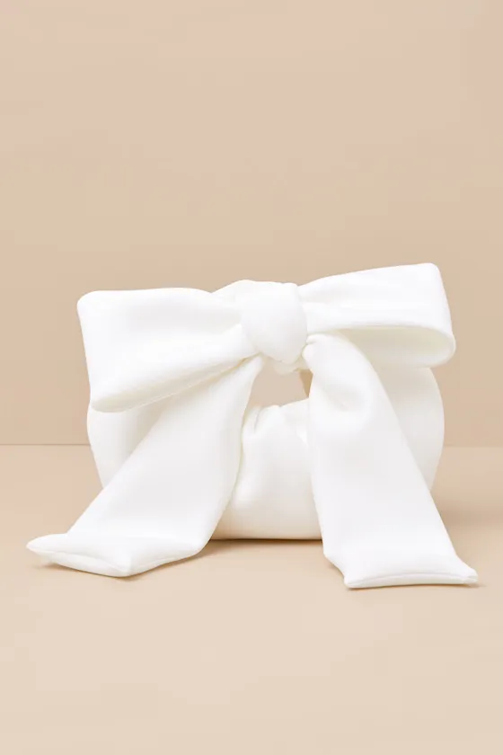 Bowie Ivory Bow Handbag sold by Lulus