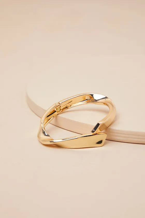 Bold Mode Gold Twisted Cuff Bracelet sold by Lulus