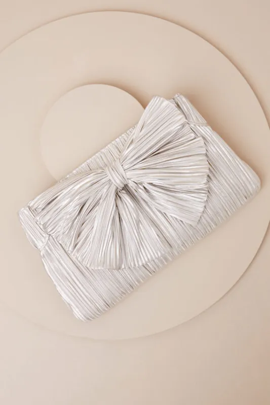 Odilia Champagne Lurex Pleated Bow Clutch sold by Lulus