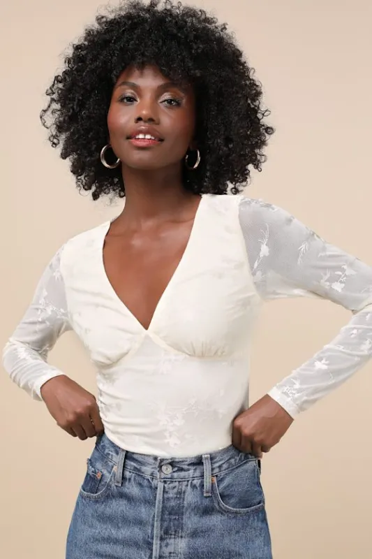 Chicly Mesmerizing Ivory Mesh Burnout Long Sleeve Bodysuit sold by Lulus