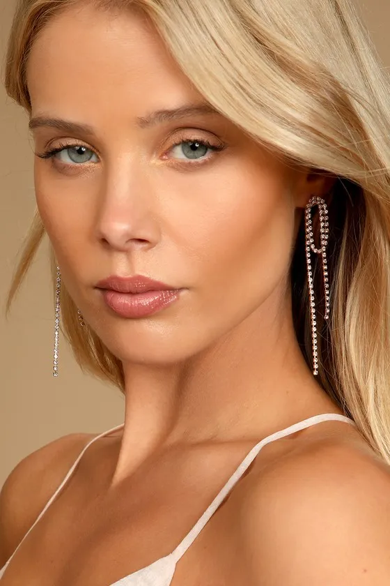 Daring to Dazzle Gold Rhinestone Chain Earrings sold by Lulus