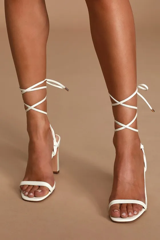 Xylia White Lace-Up Heels sold by Lulus