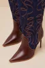 Tyrant Denim Multi Leather Knee-High High Heel Western Boots sold by Lulus
