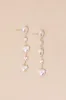 Endlessly Lovable Gold and White Pearl Heart Drop Earrings sold by Lulus