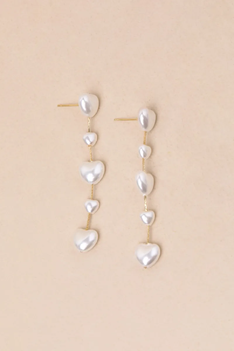 Endlessly Lovable Gold and White Pearl Heart Drop Earrings sold by Lulus