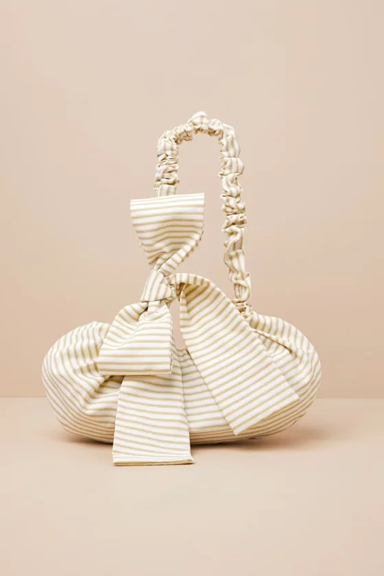 Crossbowie Ivory Striped Bow Bag sold by Lulus