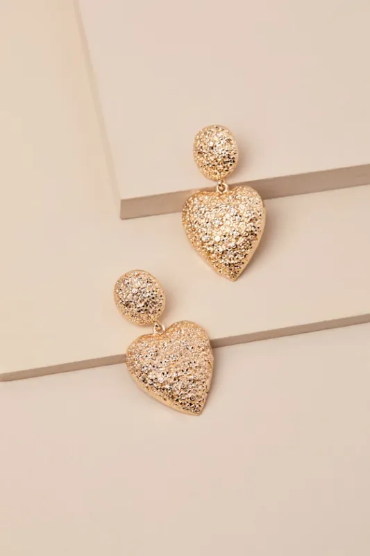 Cherished Glow Gold Hammered Heart Earrings sold by Lulus