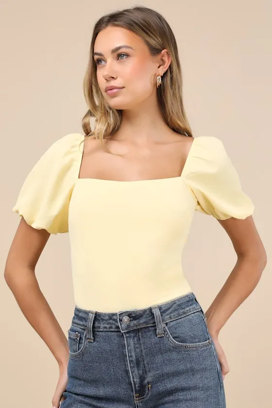 Abundance of Love Yellow Textured Puff Sleeve Tie-Back Bodysuit sold by Lulus