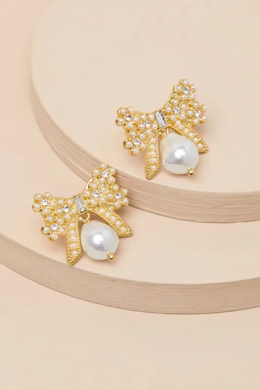 Carabella 14KT Gold Rhinestone Pearl Bow Earrings sold by Lulus