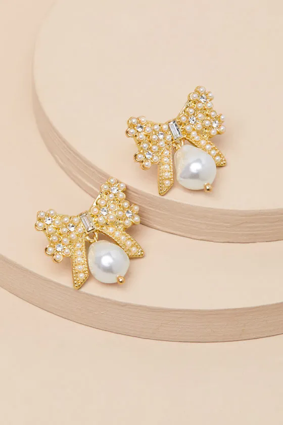 Carabella 14KT Gold Rhinestone Pearl Bow Earrings sold by Lulus
