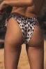 Namir White Leopard Side-Tie Bikini Bottoms sold by Lulus