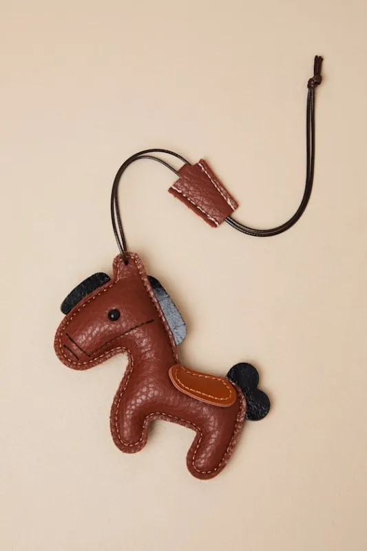 Ballantine Brown Vegan Leather Horse Bag Charm sold by Lulus