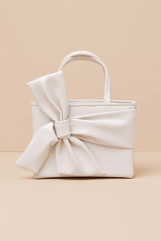 Licinda Ivory Bow Handbag sold by Lulus