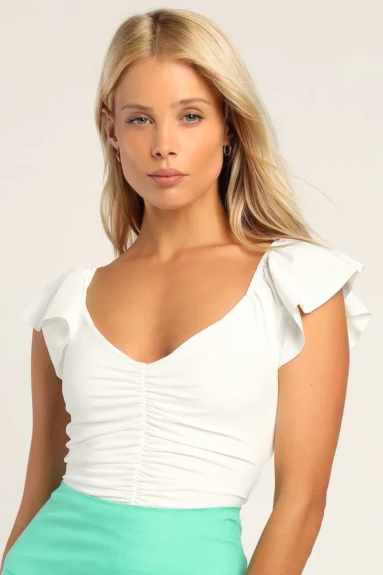 A Little Bit Of Love Ivory Ruched Flutter Sleeve Bodysuit sold by Lulus