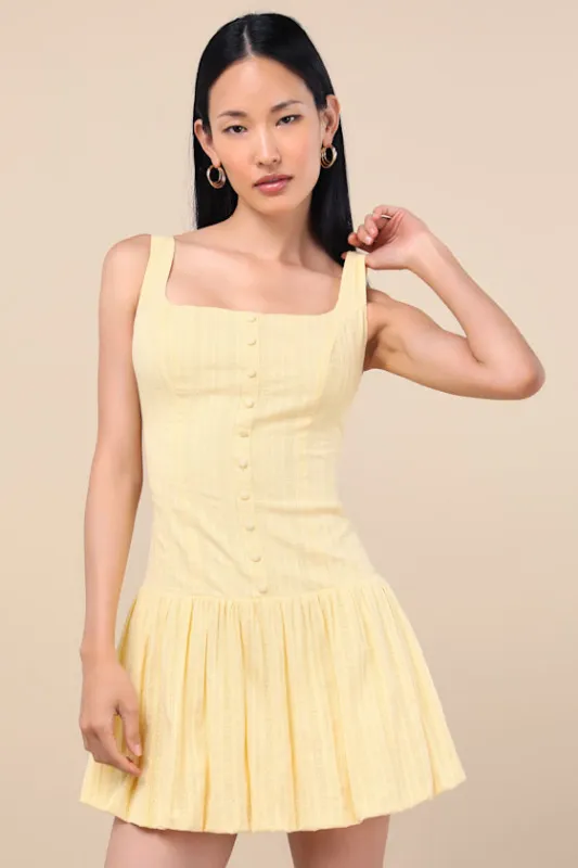 Khamari Yellow Textured Drop Waist Bubble-Hem Mini Dress sold by Lulus