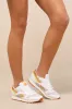 Classic Leather White and Amber Suede Sneakers sold by Lulus