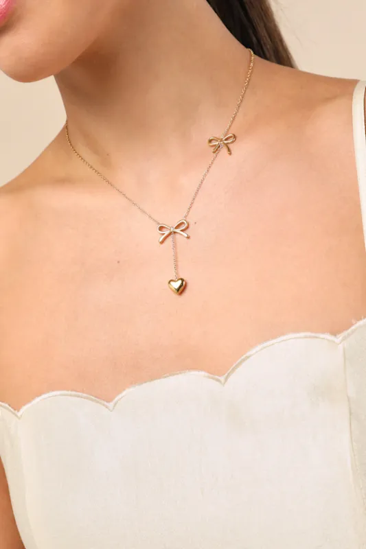 Elsy Gold Bow and Heart Drop Necklace sold by Lulus