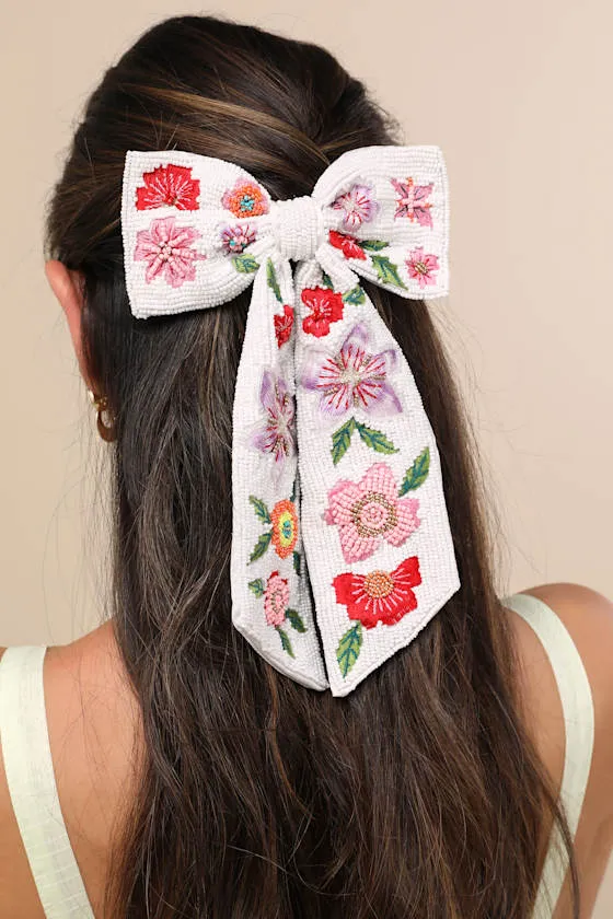 Cayson White Floral Beaded Bow Hair Clip sold by Lulus