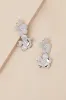 Alstra Silver Flower Statement Earrings sold by Lulus
