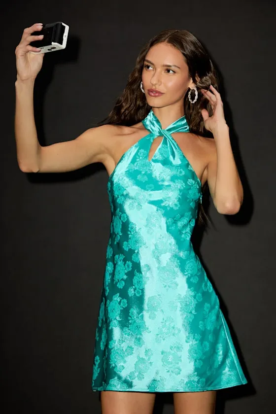 Got the Key Teal Green Satin Floral Jacquard Halter Mini Dress sold by Lulus