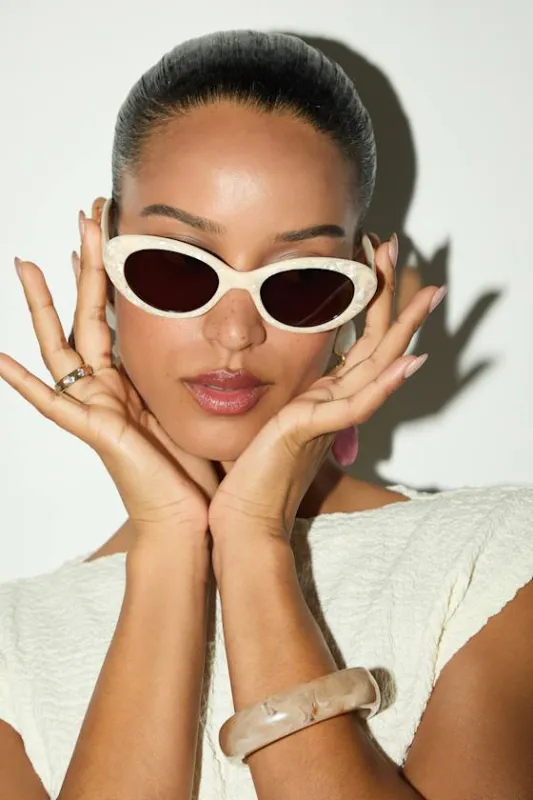 Eilian Ivory Opalescent Oval Sunglasses sold by Lulus