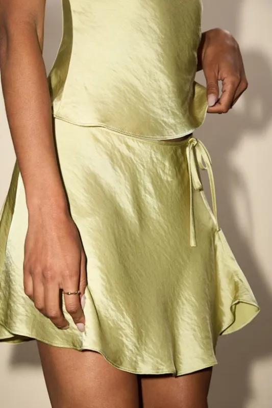 Nicolas Lime Satin Wrap Mini Skirt sold by Lulus