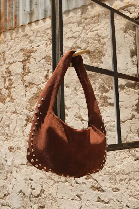 Artea Brown Suede Studded Shoulder Bag sold by Lulus