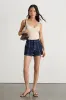 Emberlin Beige Ribbed Low-Back Sleeveless Bodysuit sold by Lulus
