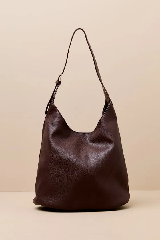Ezell Dark Brown Vegan Leather Studded Tote Bag sold by Lulus