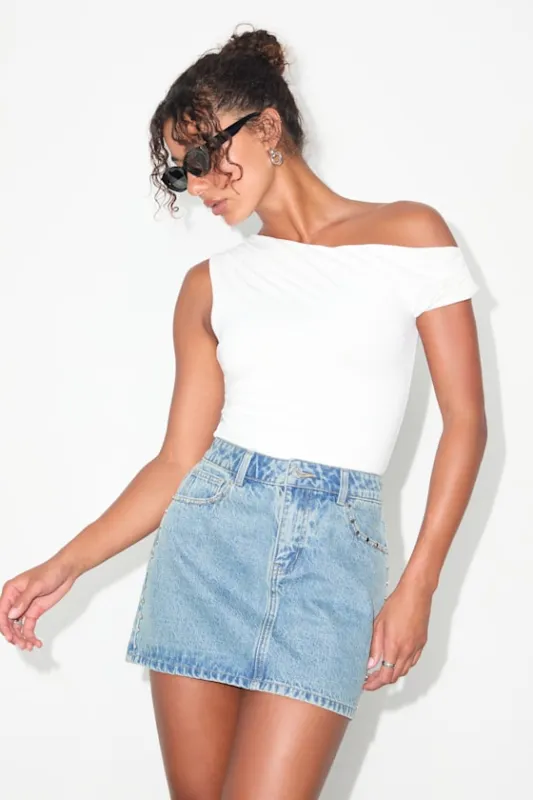 Tayana Light Wash Studded Denim Mini Skirt sold by Lulus