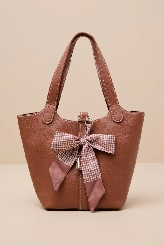 Janani Brown Vegan Leather Bow Charm Tote Bag sold by Lulus