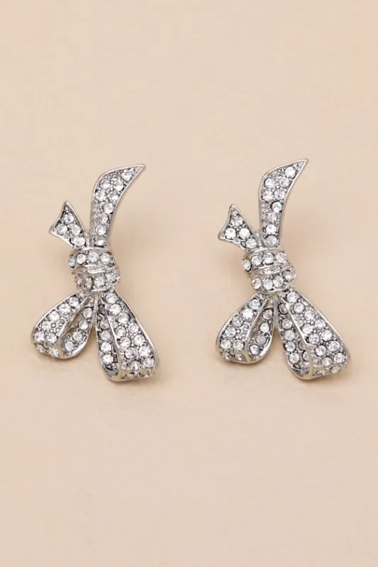 Mavienne Silver Rhinestone Bow Earrings sold by Lulus