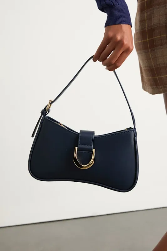 Oh-So Chic Navy Buckle Shoulder Bag sold by Lulus