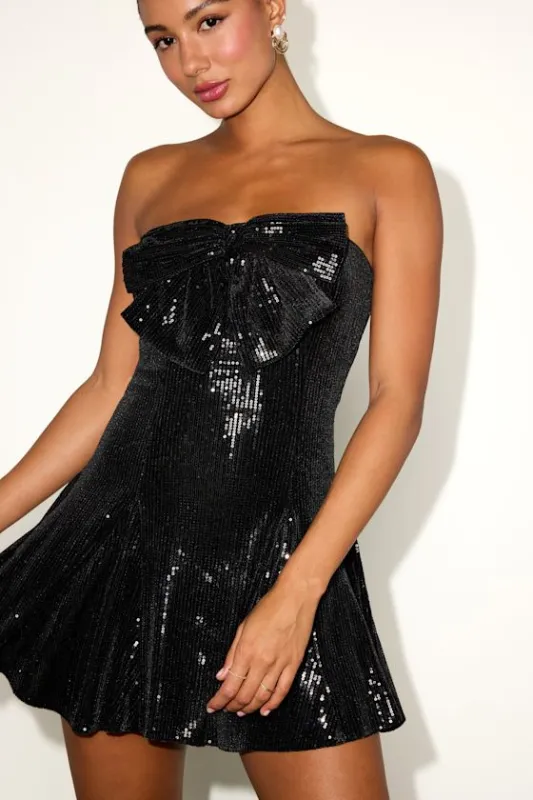 Pamira Black Velvet Sequin Bow Strapless Pleated Mini Dress sold by Lulus