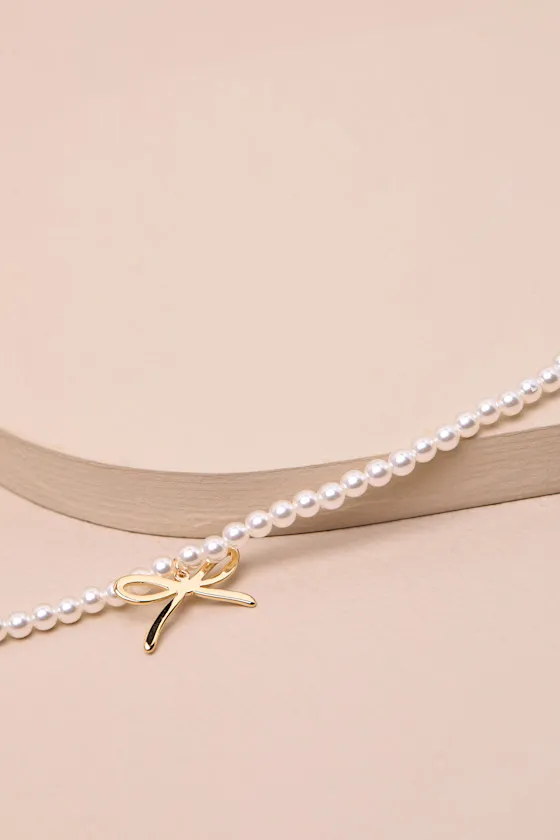 Arquette White Pearl Bow Charm Necklace sold by Lulus product image thumbnail 2