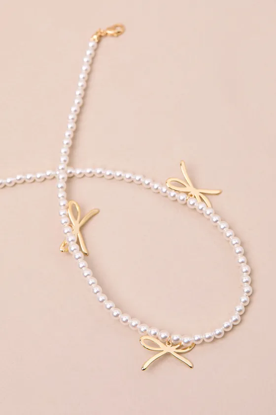 Arquette White Pearl Bow Charm Necklace sold by Lulus product image thumbnail 3