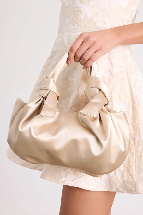 Maelynn Champagne Satin Knotted Handle Bag sold by Lulus