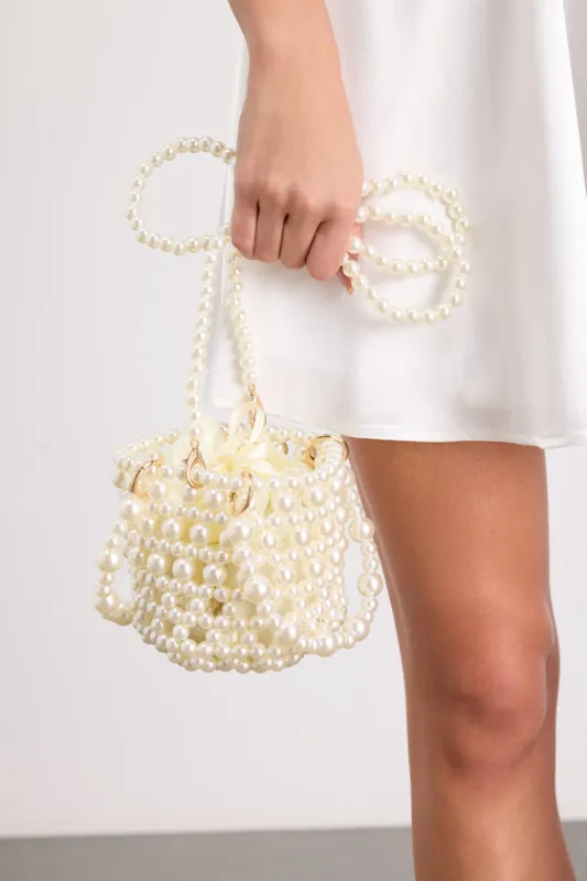 Nicolette White Pearl Crossbody Bucket Bag made by Lulus