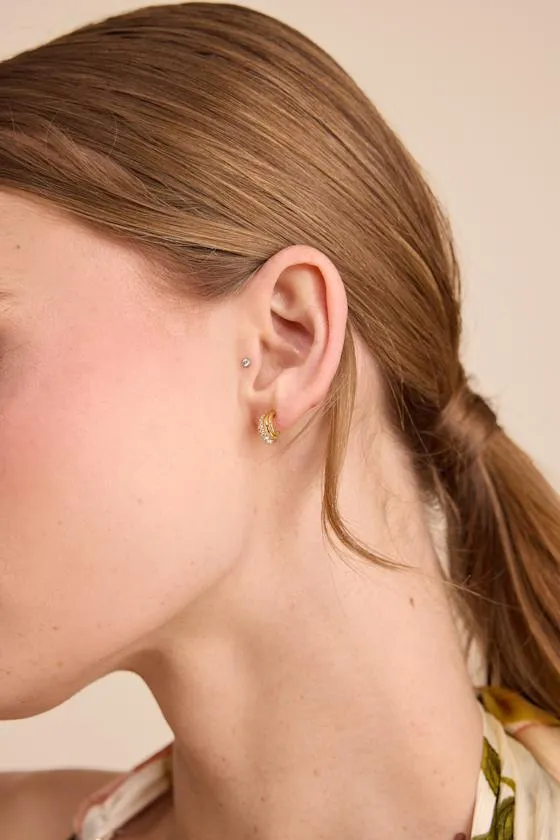 The Multi Piercing 14KT Gold Rhinestone Huggie Hoop Earrings sold by Lulus