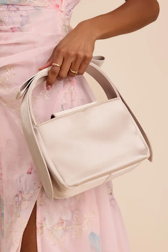 Britney Champagne Satin Bow Handbag sold by Lulus
