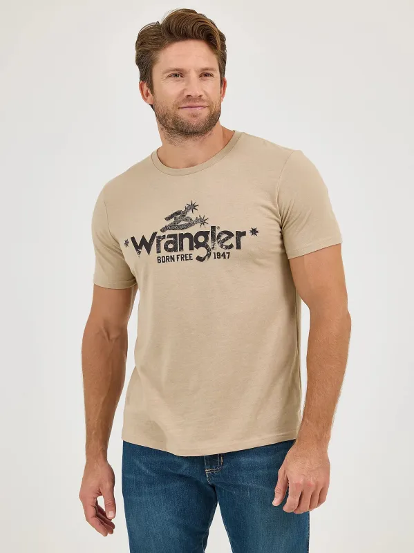 WRANGLER MENS BORN FREE GRAPHIC TEE - BEIGE SPUR sold by Bridle Path Tack Shop