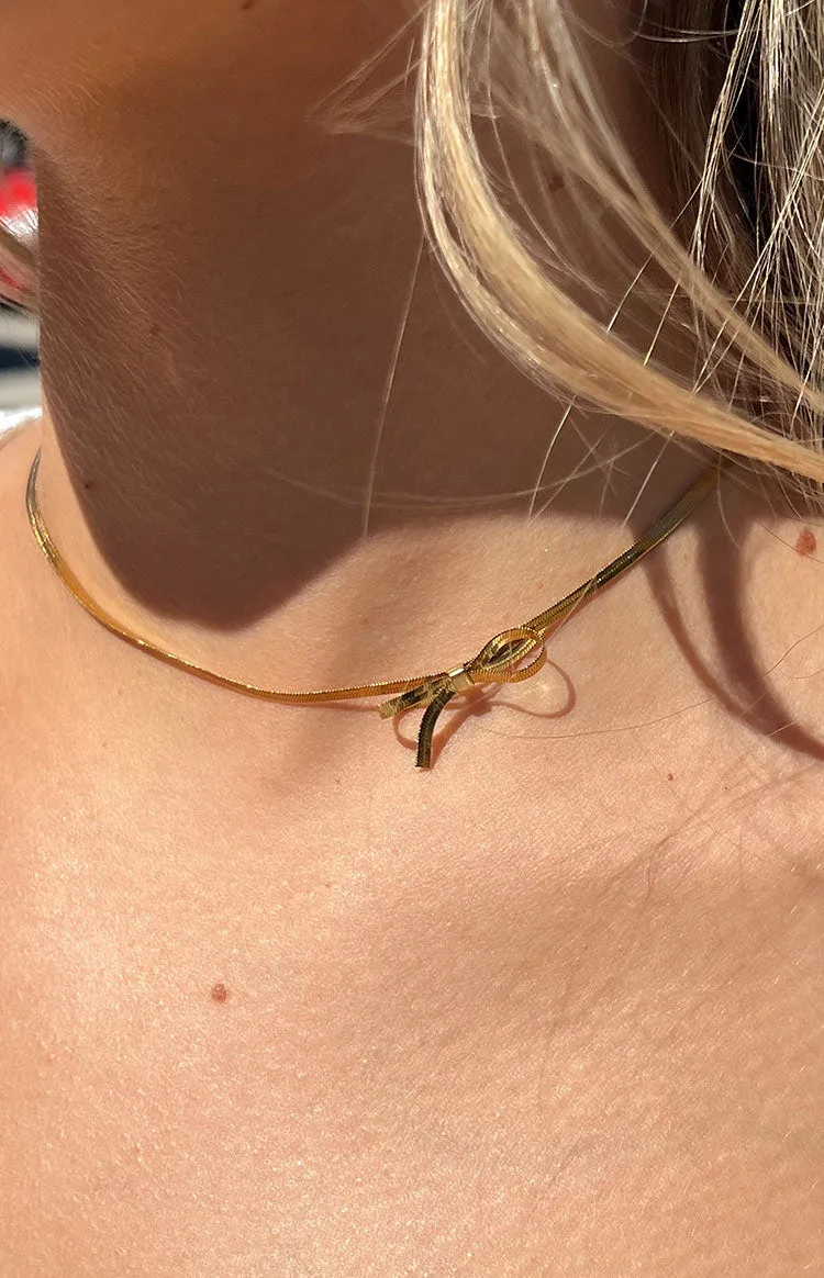 Brylee Gold Bowknot Pendant Necklace sold by Beginning Boutique