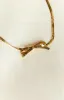 Brylee Gold Bowknot Pendant Necklace sold by Beginning Boutique